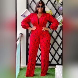 - RED & BLACK PRINT JUMPSUIT WITH FRONT BUTTON AND BACK ZIPPER.